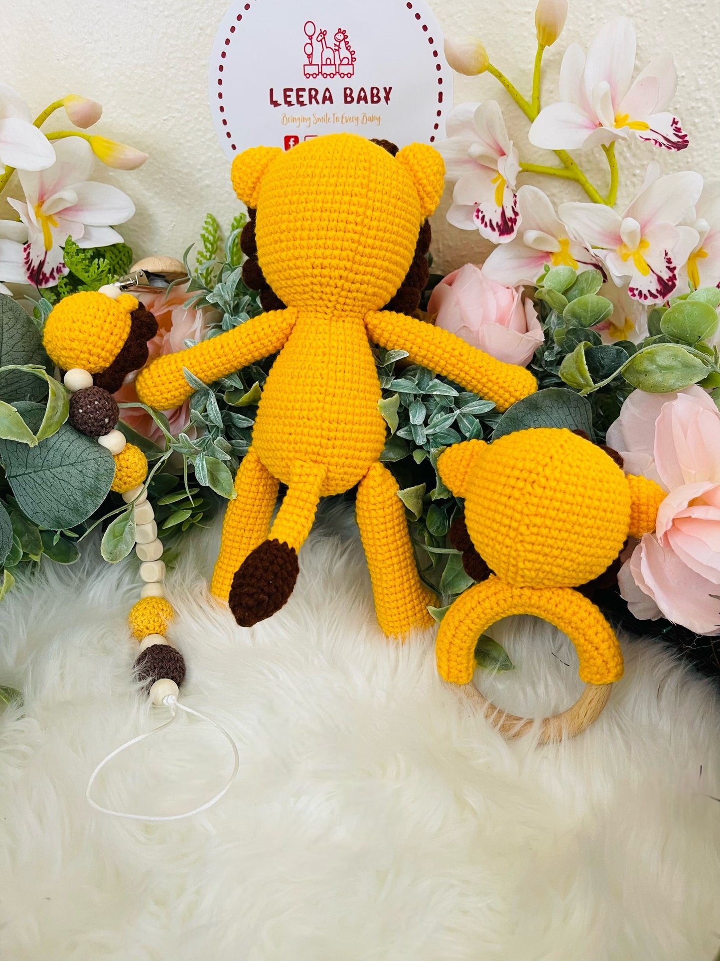 Crochet Lion Toy with Teething Rattle and Pacifier Holder.