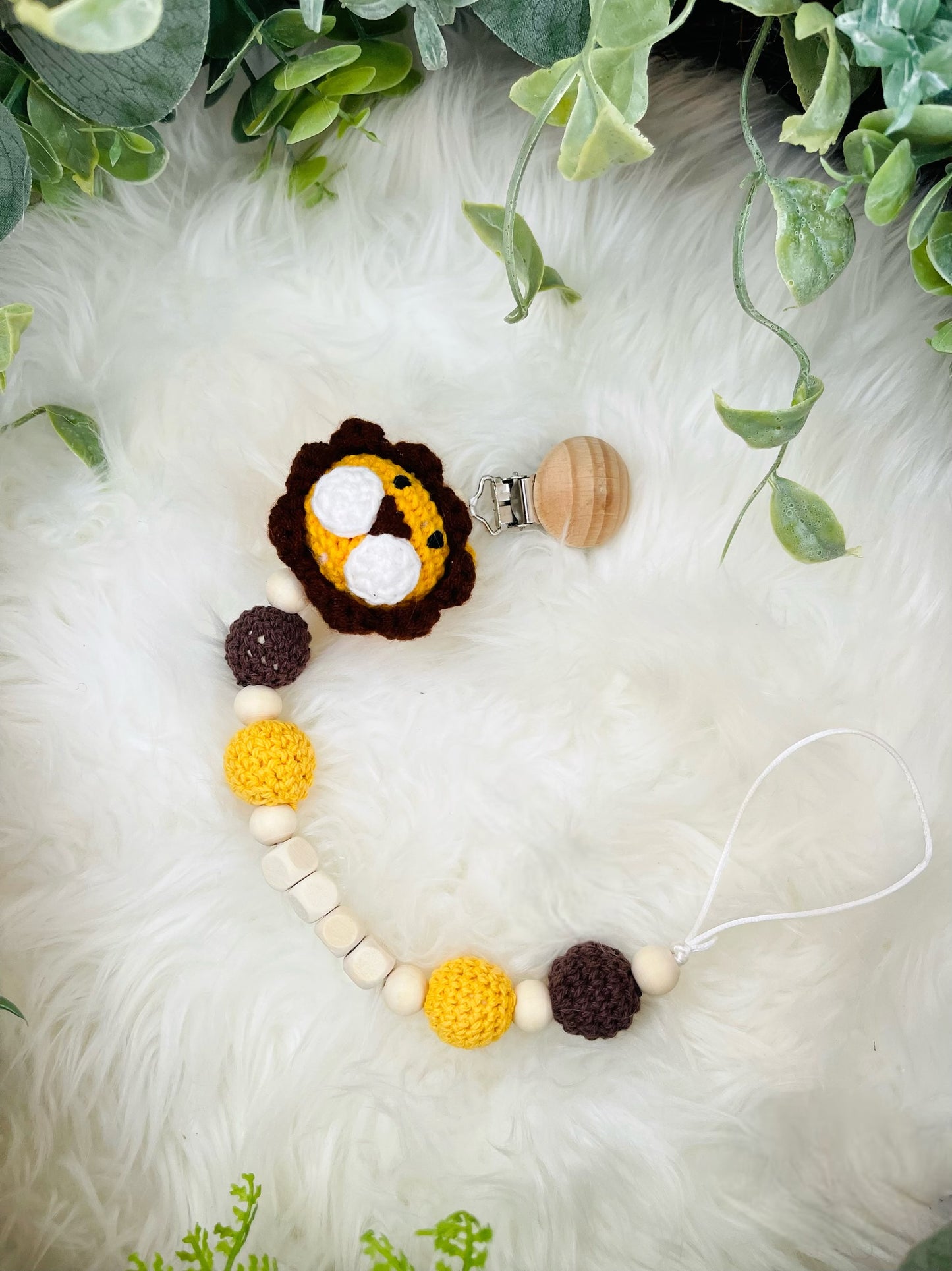 Crochet Lion Toy with Teething Rattle and Pacifier Holder.