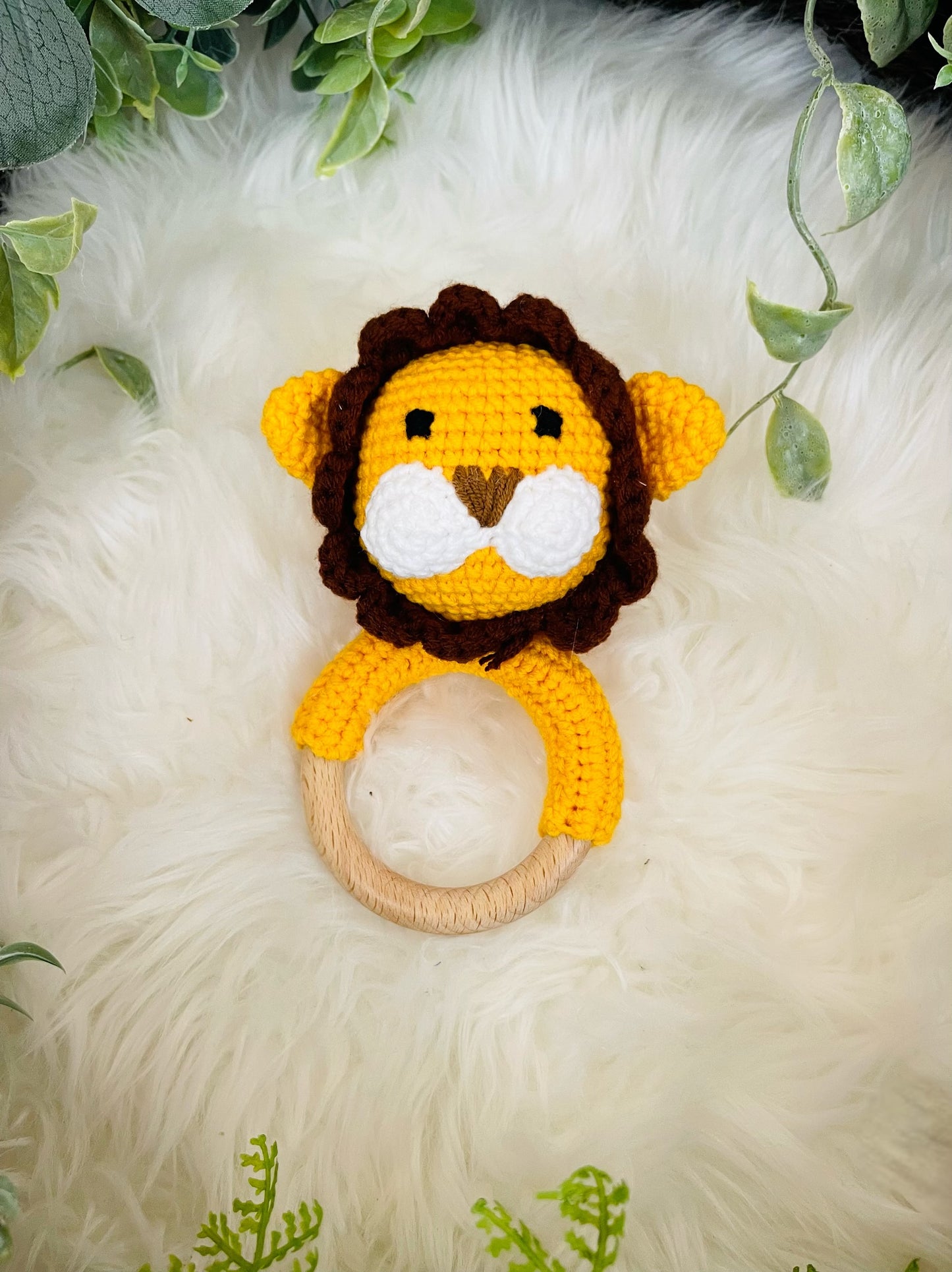 Crochet Lion Toy with Teething Rattle and Pacifier Holder.